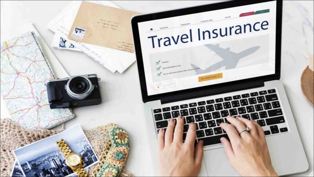 A person using laptop on travel insurance